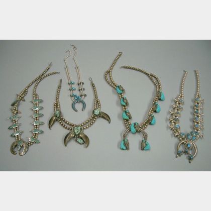 Four Southwestern Silver Squash Blossom-type Necklaces and a Bear Claw Necklace. 