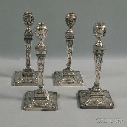 Set of Four English Weighted Silver-clad Candlesticks