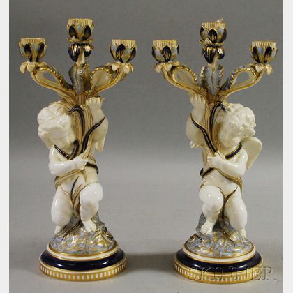 Pair of European Gilt and Cobalt-decorated Porcelain Putti Figural Candelabra