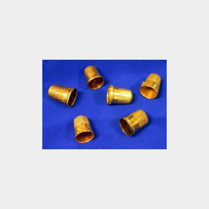 Six Gold and Gold-filled Thimbles. 