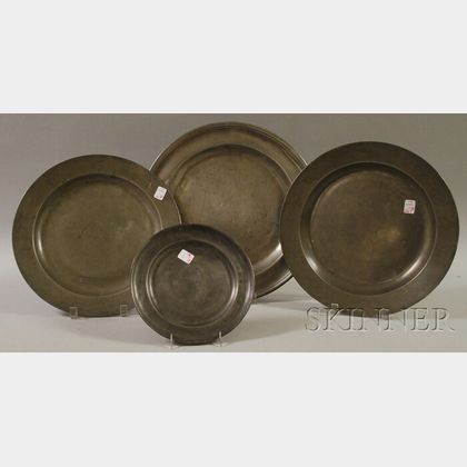 Three Pewter Chargers and a Plate