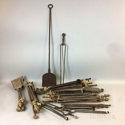 Approximately Thirty Brass and Iron Fireplace Shovels and Pairs of Tongs. Estimate $200-300