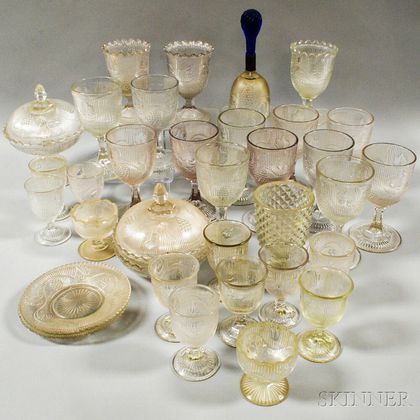 Approximately Thirty-four Pieces of Colorless Grapevine-pattern Pressed Glass. Estimate $300-500