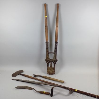 Five Wood and Iron Garden Tools. Estimate $20-200