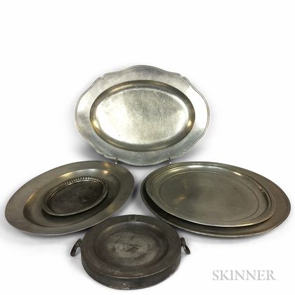 Five Pewter Chargers and Platters and a Warming Dish