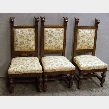 Set of Three Renaissance-style Upholstered Carved Oak Side Chairs. 