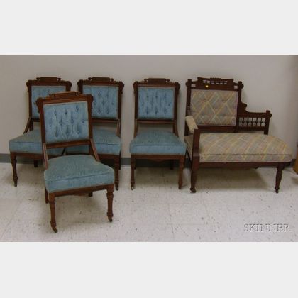 Set of Four Victorian Eastlake-type Upholstered Carved Walnut Parlor Side Chairs and a Settee. 