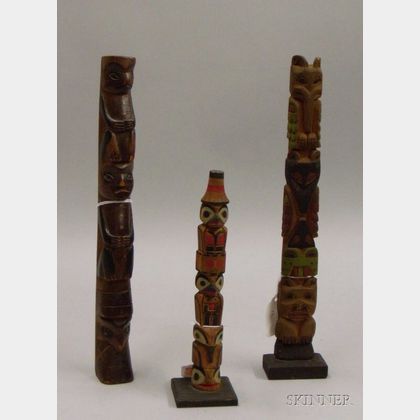 Three Northwest Polychrome Totem Poles