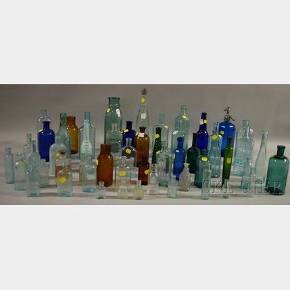 Fifty-three Mostly Aqua and Colored Pressed and Molded Glass Bottles