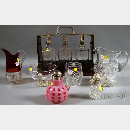 Six Glassware Items and a Tantalus with Three Bottles with Etched Decoration