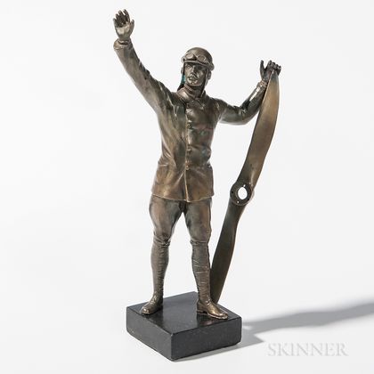 Cast Bronze Statuette of an Aviator Holding a Propeller