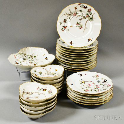 Thirty Pieces of Limoges Porcelain Bird-decorated Tableware. Estimate $200-250