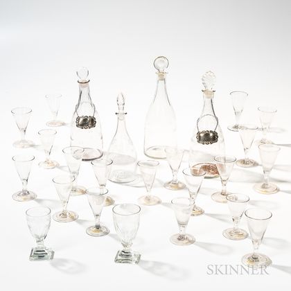Four Wheel-engraved Decanters and Twenty-one Blown Wines