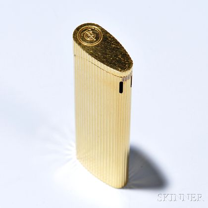 Lighter, Tiffany & Co., in ribbed gold-tone metal, lg. 3 1/8 in., signed. 