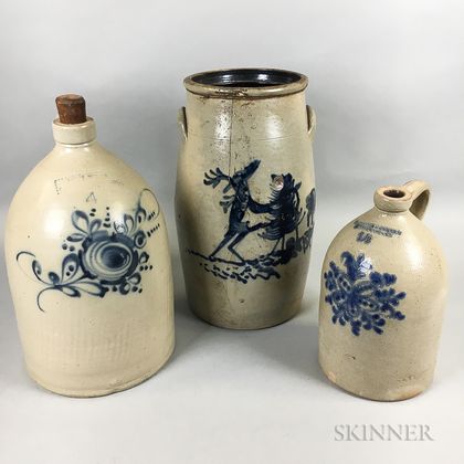 Two Cobalt-decorated Stoneware Jugs and a Churn