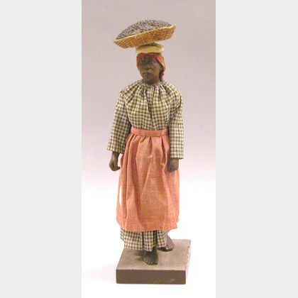 Plaster Model of Black Woman in Traditional Cotton Clothing Carrying Basket of Produce.