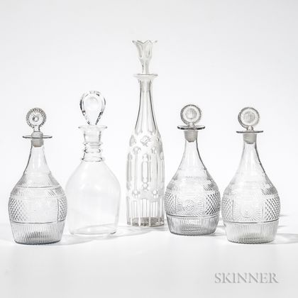 Five Glass Decanters, one white cut-to-clear.Provenance: The estate of Susan J. Lyman. 