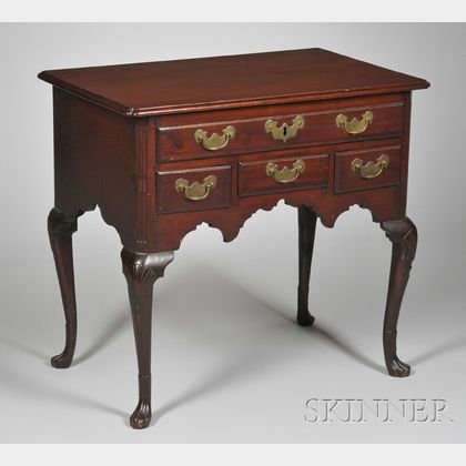 Queen Anne Carved Walnut Dressing Table with Paw Feet