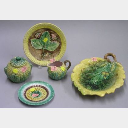 Majolica Pineapple-form Creamer and Sugar, Two Majolica Plates, and a Leaf-form Tray with Acorns. 