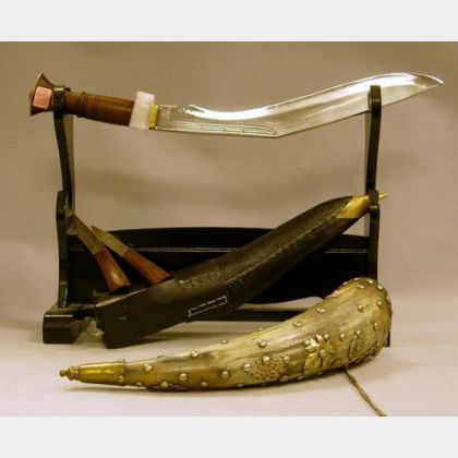 Tacked Brass Decorated Powder Horn, a Kukri Knife, and a Wooden Sword Stand. 