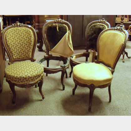 Four Victorian Rococo Revival Carved Rosewood and Rosewood Veneer Parlor Chairs. 