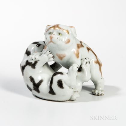 White-glazed Porcelain Figurine of Two Puppies Wrestling