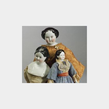Three Brown-Eyed China Head Dolls