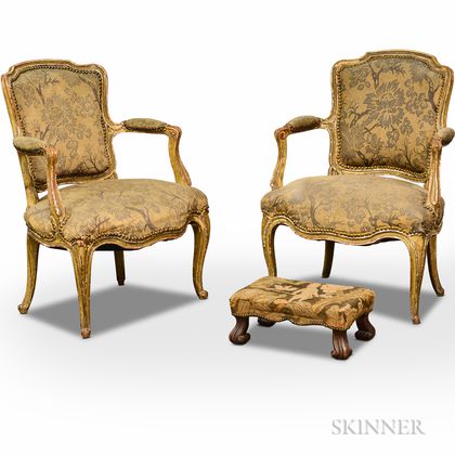 Pair of French Provincial Painted Gesso and Fruitwood Fauteuils and a Footstool