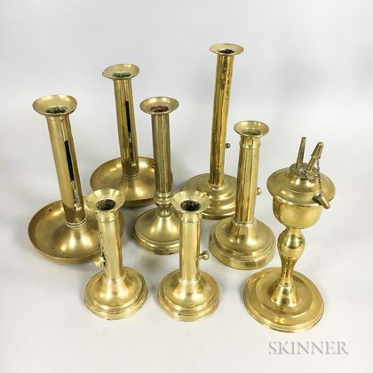 Seven Brass Push-up Candlesticks and a Whale Oil Lamp