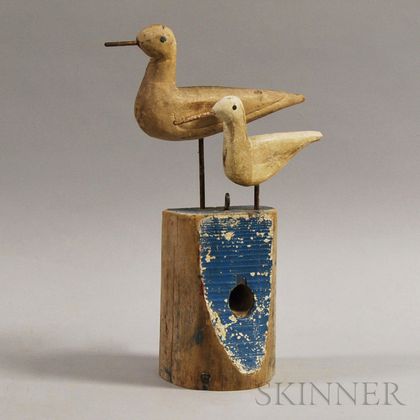 Two Carved and Painted Shorebirds on a Blue Post