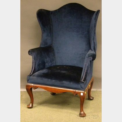 Queen Anne-style Upholstered Carved Mahogany Wing Chair. 