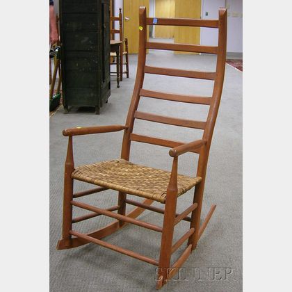Maple Crooked Ladder-back Rocking Armchair with Woven Splint Seat. 