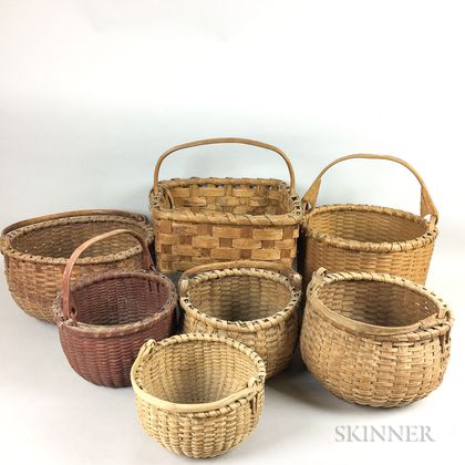 Seven Woven Splint Swing-handled Baskets. Estimate $100-200