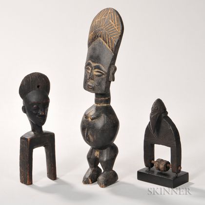 African Wood Carving of a Man and Two Heddle Pulleys. Estimate $200-400