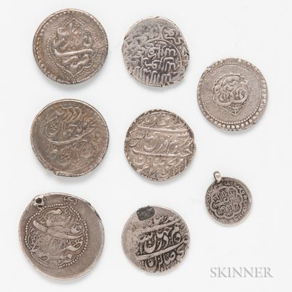 Eight Islamic Silver Coins. Estimate $300-500