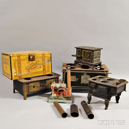 Four Miniature Stoves, a Steam Engine, and an Advertising Tin