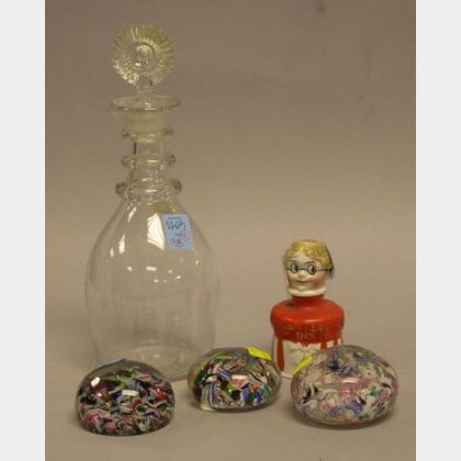 Three Glass Paperweights, a Clear Glass Three-Ring Decanter, and a Carters Ink Ceramic Figural Bottle. 
