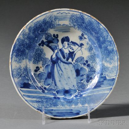Delft Plate Decorated with a Woman Holding a Cornucopia and a Flower Stem