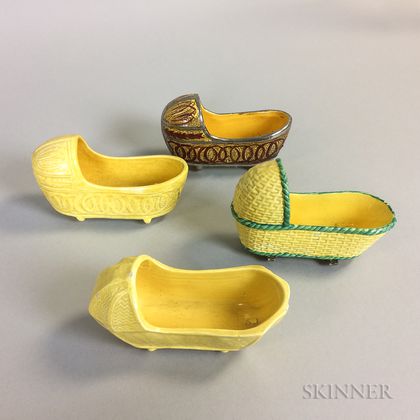 Four Staffordshire Yellow-glazed Ceramic Cradles