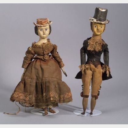 Pair of Painted Papier-mache and Carved Wood Dolls