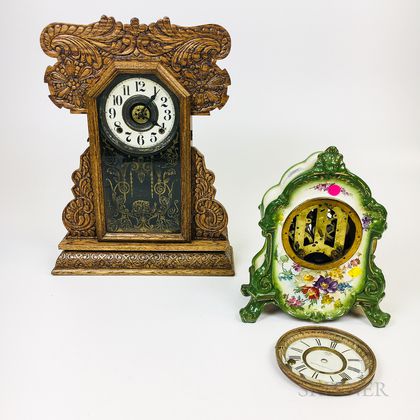 Carved Oak Gingerbread Shelf Clock and an Ansonia Ceramic Mantel Clock. Estimate $100-150