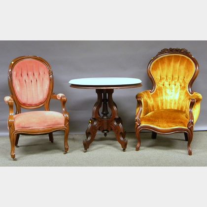 Two Victorian Rococo Revival Upholstered Carved Walnut Parlor Armchairs and a Victorian Oval White Marble-top Walnut Occasional Tabl...