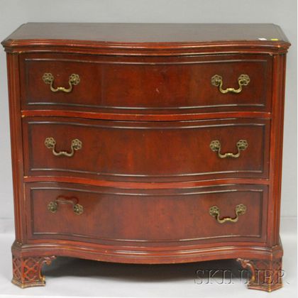 Chippendale-style Carved Mahogany Serpentine Three-Drawer Chest. 