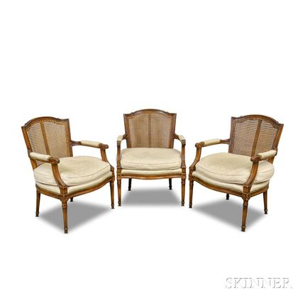 Set of Three Louis XVI-style Caned Fruitwood Fauteuil