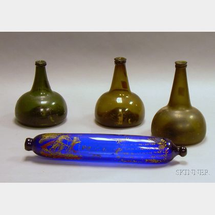 Three Amber and Olive Blown Glass Rum Bottles and a Paint Decorated Cobalt Blown Glass Rolling Pin Whimsy. 
