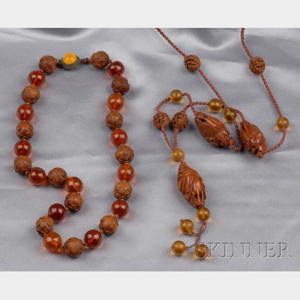 Two Carved Peach Pit and Amber Bead Necklaces