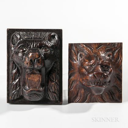 Two Carved Oak Lion Plaques