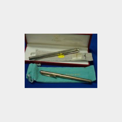 Cartier Silver Cased Pen and a Tiffany Silver Cased Pen Each with Original Boxes. 