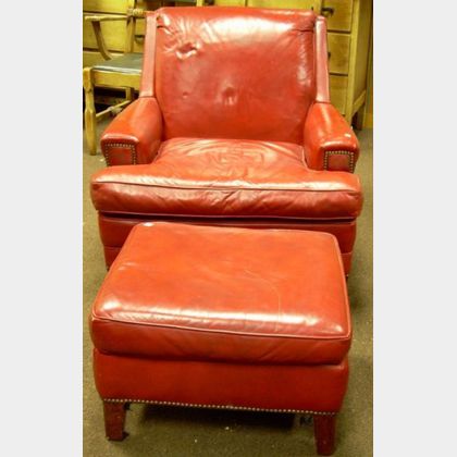 Red Leather Upholstered Armchair and Ottoman. 