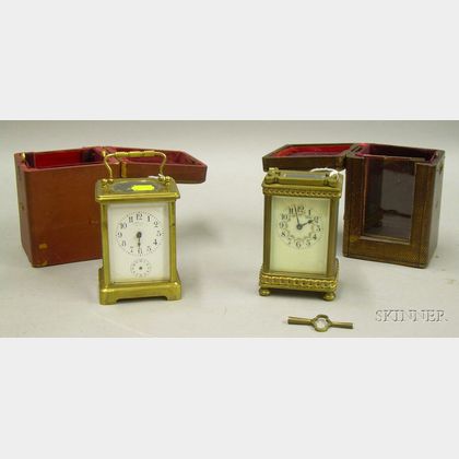 Two French Time-only Carriage Clocks in Leather Carrying Cases